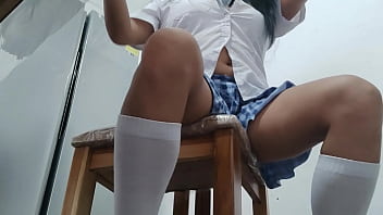 A female student in a short skirt starts a strange and sexual game she's in her chair at home masturbating her vaginal hole with a dildo she enjoys it like a whore