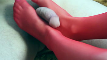Plays with a dick in heels and jerks off a dick with her feet foot fetish cumshot on her feet
