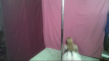 Masked redhead milf dancing on pole