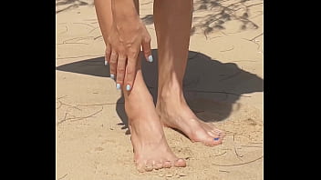 Naked teen girl shows pussy legs and feet and toes foot leg fetish on nudist beach public outdoor