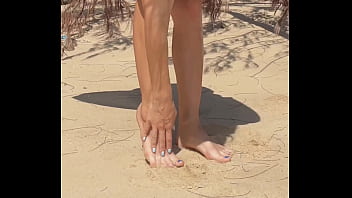 Naked teen girl shows pussy legs and feet and toes foot leg fetish on nudist beach public outdoor