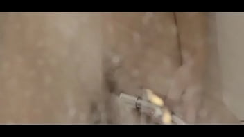 Reaching orgasm in the charming shower