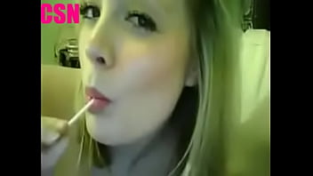 Blonde sucking lollipop