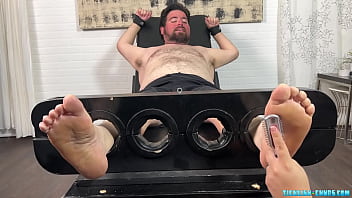 Cute Nemo Set Up To Tickle On A Bondage Bed thumbnail