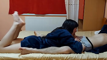 Hot young couple passionately make love in the bedroom