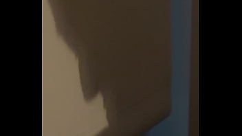 The shadow reflects her sucking his cock