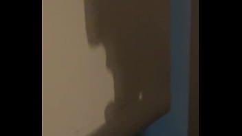 The shadow reflects her sucking his cock