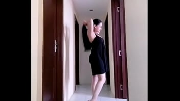 Mylola walking in a dress