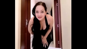 Mylola walking in a dress