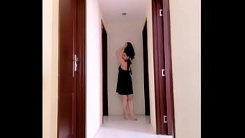 Mylola walking in a dress