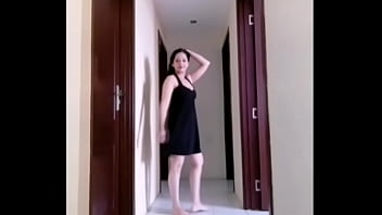 Mylola walking in a dress