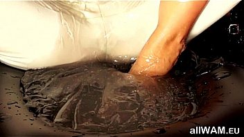 Clothed captive gets lubed