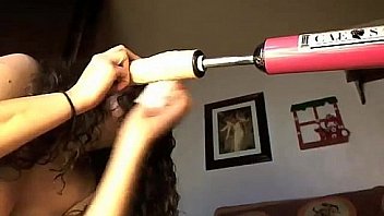 Brunette masturbates with a vibrator and a dildo machine