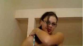 Nice busty girl with glasses reveals her tits