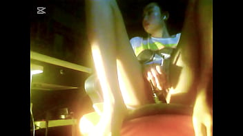 The camera under the table captured a beautiful woman at home alone and watching a porn movie