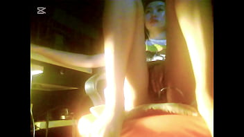 The camera under the table captured a beautiful woman at home alone and watching a porn movie