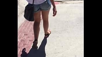 Sexy girl in booty shorts walking voyeur