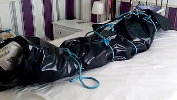 Wrapped and tied in newspaper then wrapped in a plastic sheet