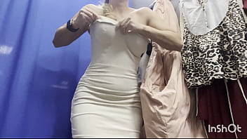 A naked woman in a public fitting room