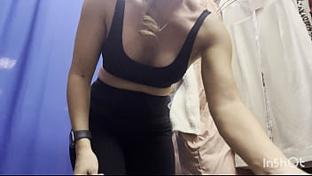 A naked woman in a public fitting room