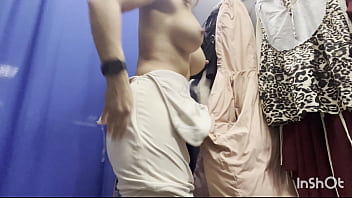 A naked woman in a public fitting room