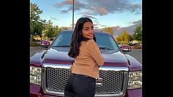 Hot brown haired girl with fat ass and big tits standin on truck