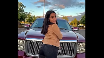 Hot brown haired girl with fat ass and big tits standin on truck
