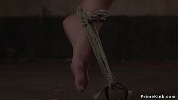 Brunette slave gets pussy tormented by rough master in dungeon