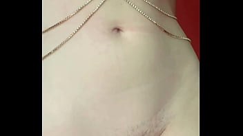 Redhead in bodychain listening to the chain