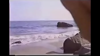 Blonde carries man from beach