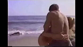 Blonde carries man from beach