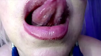 A mature lady with glasses takes off a yellow dress in private and plays with her mature pussy