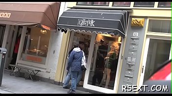 Dark beauty sucks a large pole