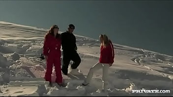 Members of the ski rescue patrol find a stranded skier and screw him