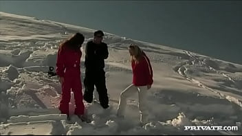 Members of the ski rescue patrol find a stranded skier and screw him