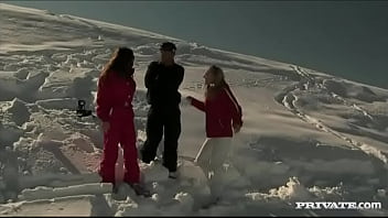Members of the ski rescue patrol find a stranded skier and screw him
