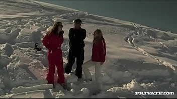 Members of the ski rescue patrol find a stranded skier and screw him