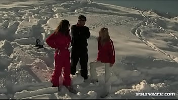 Members of the ski rescue patrol find a stranded skier and screw him