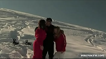 Members of the ski rescue patrol find a stranded skier and screw him