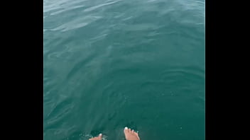 The warm sea water caresses my feet