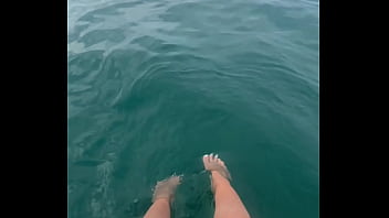 The warm sea water caresses my feet