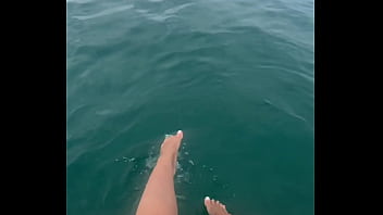 The warm sea water caresses my feet