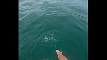 The warm sea water caresses my feet