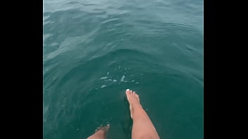 The warm sea water caresses my feet