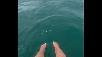 The warm sea water caresses my feet