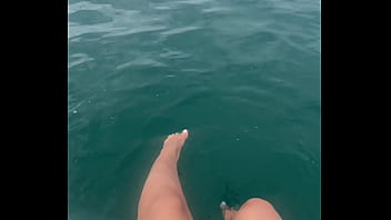 The warm sea water caresses my feet