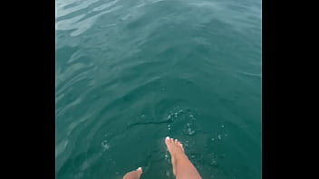 The warm sea water caresses my feet