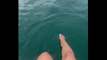 The warm sea water caresses my feet