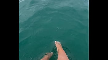 The warm sea water caresses my feet