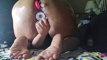 Ebony milf bend over for back shots using glass dildo